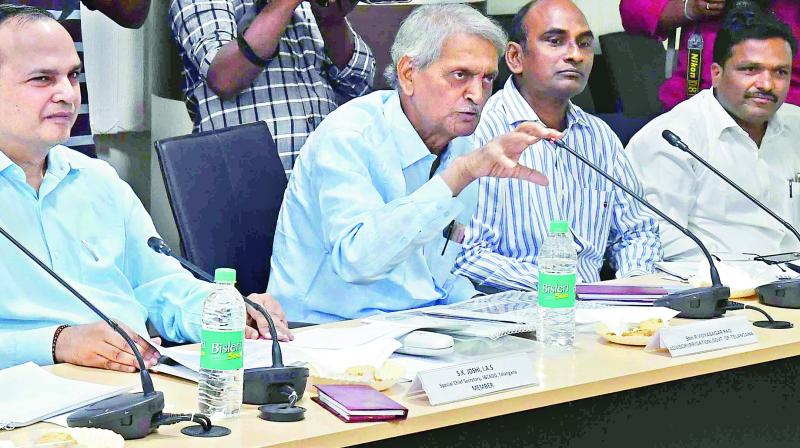 Adviser to the TS government R. Vidyasagar Rao and special chief secretary S.K. Joshi make a point during their meeting with the experts panel in Hyderabad on Monday.