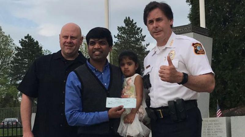 Police reward Anil Vannavalli, a data administrator, who was robbed saving unconscious woman from oncoming train (Photo: Twitter)