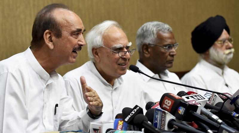 Congress leader Ghulam Nabi Azad with Congress leader Kapil Sibal address a press conference after opposition parties submitted a notice to the Vice President and Rajya Sabha Chairperson Venkaiah Naidu to initiate impeachment proceedings against Chief Justice of India Dipak Misra. (Photo: PTI)