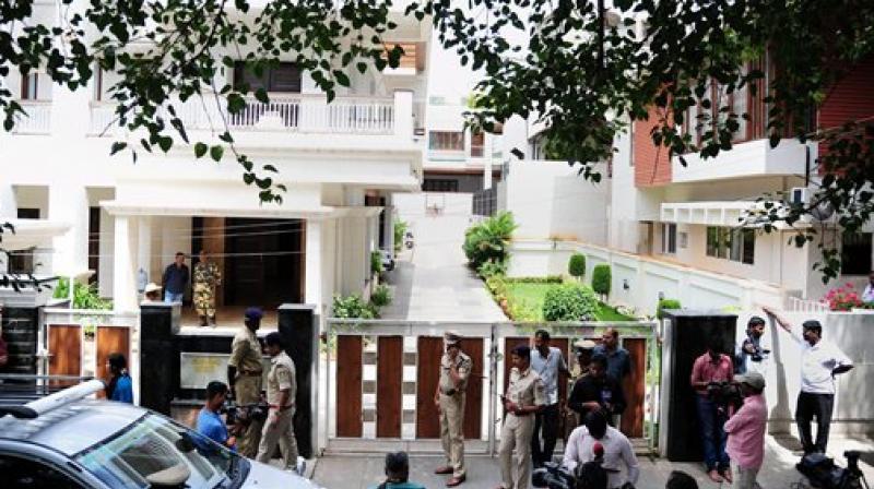 Security and media outside Karnataka Energy minister D K Shivakumars residence in Bengaluru on Wednesday. (Photo: PTI)