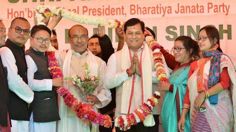 New Chief Minister of Manipur N Biren Singh with Assam Chief Minister Sarbananda Sonowal during the formers swearing-in ceremony in Imphal. (Photo: PTI)