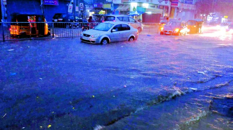 Main thoroughfares in Secunderabad were flooded following heavy rains late on Monday evening leading to traffic snarls in the city. (Photo: P. Surendra)