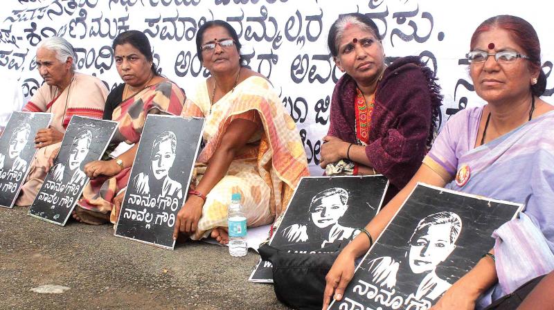 Activists demand the arrest of the murderers of slain journalist Gauri Lankesh at a protest held in Bengaluru on Monday. (Photo: DC)