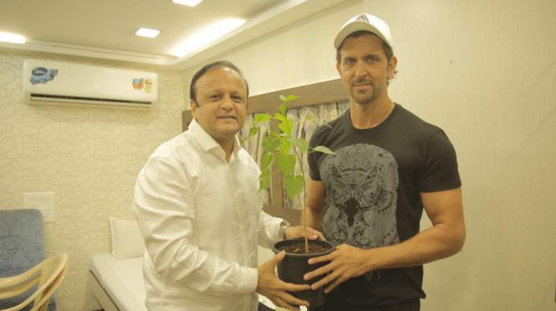 Hrithik Roshan being presented a sapling as part of the initiative.