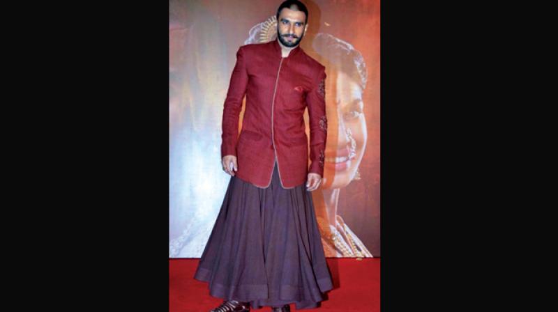 Ranveer Singh pairs his sherwani with a flowy skirt.