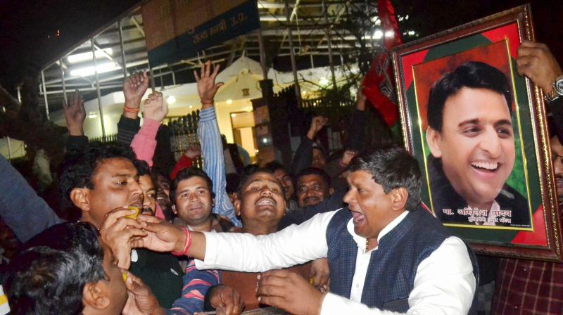 Supporters celebrate in Agra after UP Chief Minister Akhilesh Yadav got the Samajwadi Party symbol, the cycle, and the party name. (Photo: PTI)