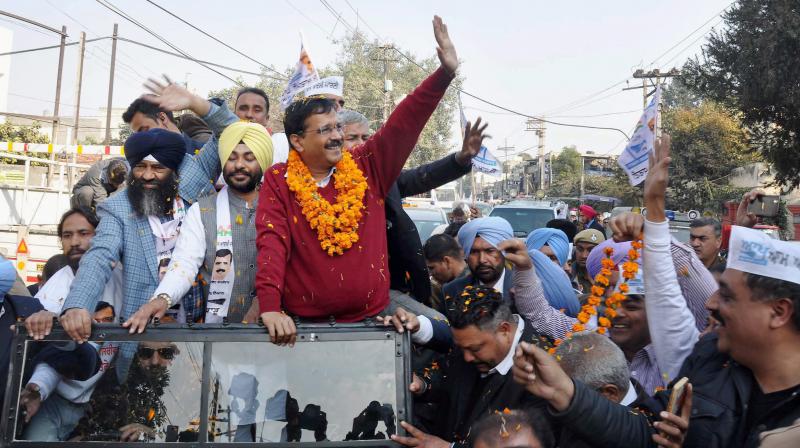 Aam Aadmi Party convener & Delhi Chief Minister Arvind Kejriwal during a road show for upcoming Punjab Assembly elections. (Photo: PTI)