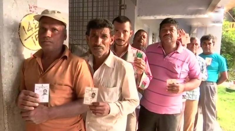 West Bengal Panchayat polls 2018: Voters queue up outside a polling booth in Sirakole village in South 24 Parganas district. (Photo: ANI | Twitter)