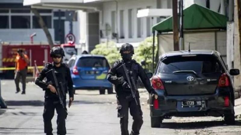 Police patrol outside Surabaya police headquarters following a suicide attack in Surabaya. (Photo: AFP)