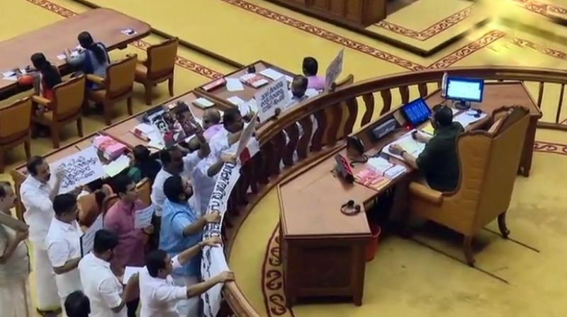 The Kerala Assembly Speaker rejected sanction for the notice of adjournment motion and also took strong objection to holding placards by the Opposition so as to hinder the view of the Chair. (Photo: ANI | Twitter)