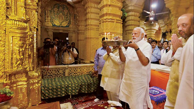 Prime Minister Narendra Modi and BJP president Amit Shah offer prayers at the Somnath Temple, in Gujarat on Wednesday. (Photo: PTI)