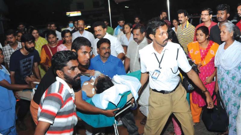 A patient being taken on a stretcher to an ambulance at Sun Medical and Research Centre, Thrissur, after fire broke out in one of the rooms during early hours on Friday.(Photo: DC)