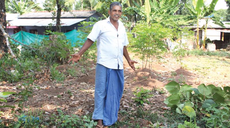 Scaria John shows the land he donated for a KWA drinking water project at Thuruthy near Kottayam. (Photo: Rajeev Prasad)