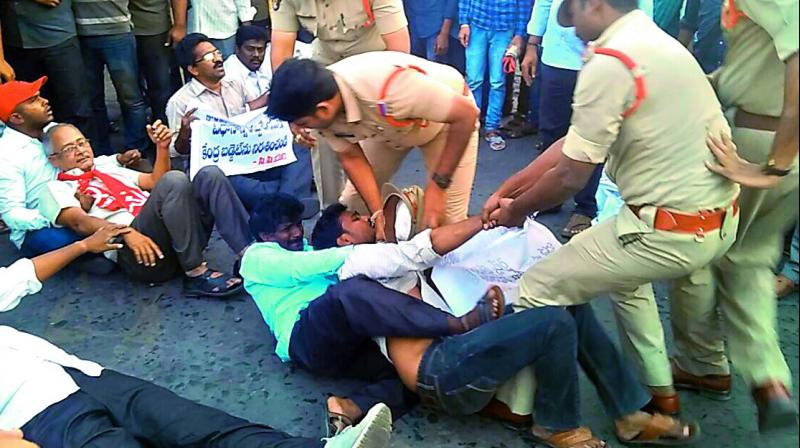 Police arrest CPM activists, when they were protesting against the Union Budget at Besant Road in Vijayawada on Thursday (Photo: DC)