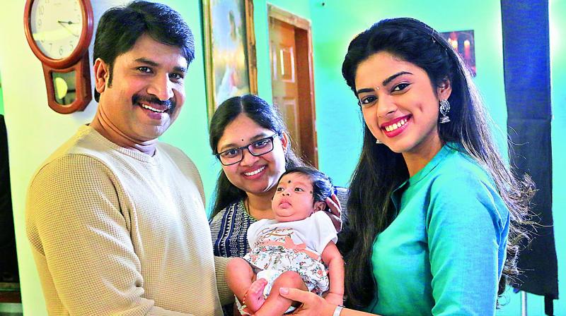 Srinivas Reddy poses with his wife and daughter; Also seen is costar Siddi