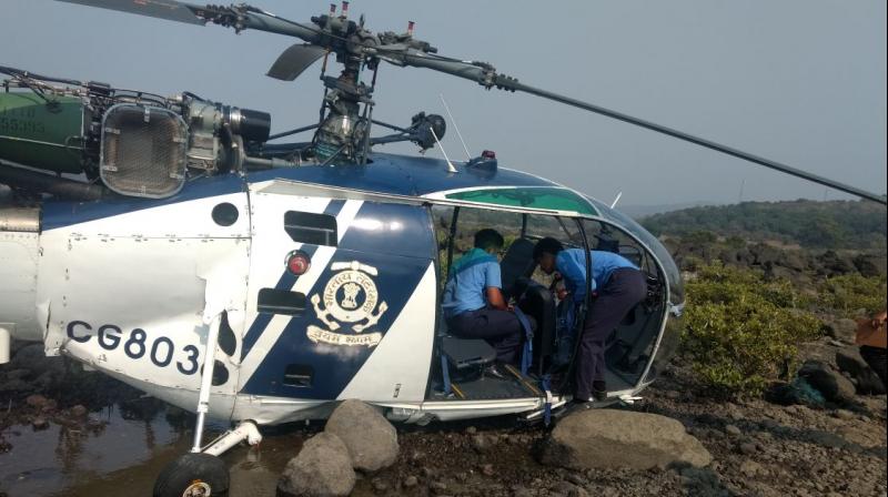 An Indian Coast Guard helicopter on a routine patrol crash landed in Raigad district of Maharashtra on Saturday afternoon. (Photo: ANI/Twitter)