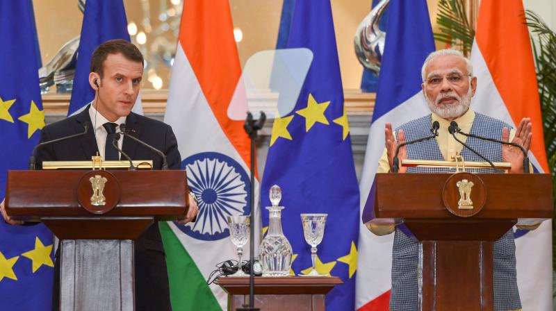 Prime Minister Narendra Modi with French President Emmanuel Macron during their joint press conference at Hyderabad House, in New Delhi on Saturday. (Photo: PTI)
