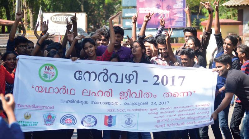 Students of St.Aloysius College, Thrissur, conduct a flash mob as part of an anti-drug campaign.