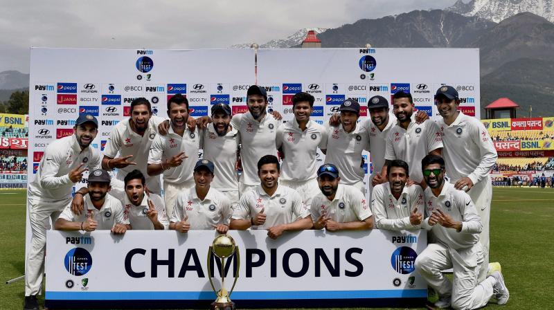 Indian team poses with the Border Gavaskar trophy after winning the series against Australia on the 4th day of fourth test match at HPCA Stadium in Dharamsala. (Photo: PTI)
