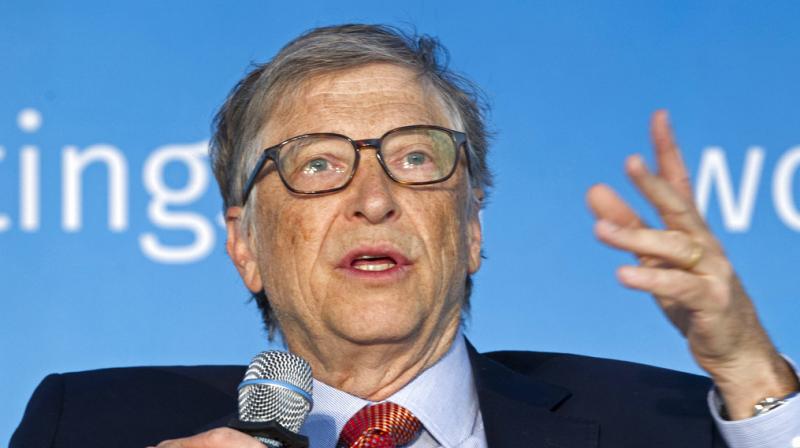 Bill Gates speaks during the World Bank/IMF Spring Meetings, in Washington. Tech moguls Gates and Mark Zuckerberg are teaming up to help develop new technologies for kids with trouble learning, which will include dabbling into child brain science.