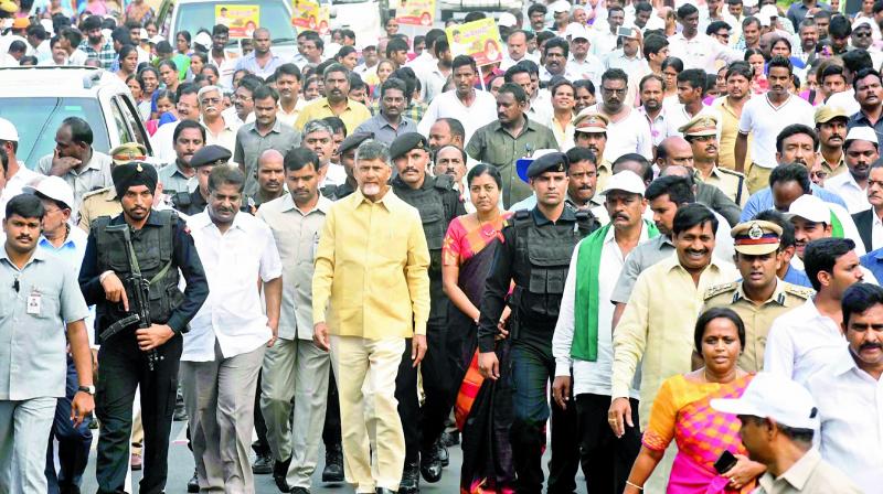 Chief Minister N. Chandrababu Naidu, ministers, NGO leaders and others take out a rally as part of the 4th Nava Nirmana Deeksha on Bandar Road in Vijayawada on Saturday. (Photo: c. narayana rao)