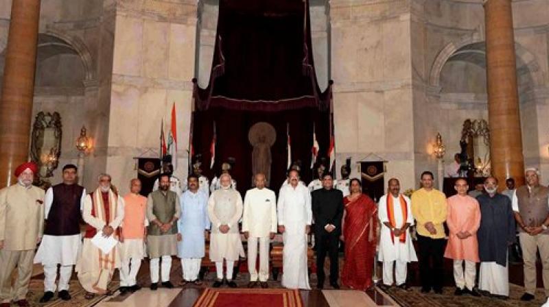 President Ram Nath Kovind, Vice President M. Venkaiah Naidu, Prime Minister Narendra Modi poses with some new members of cabinet after the reshuffle at Rashtrapati Bhavan in New Delhi on Sunday. (Photo: PTI)