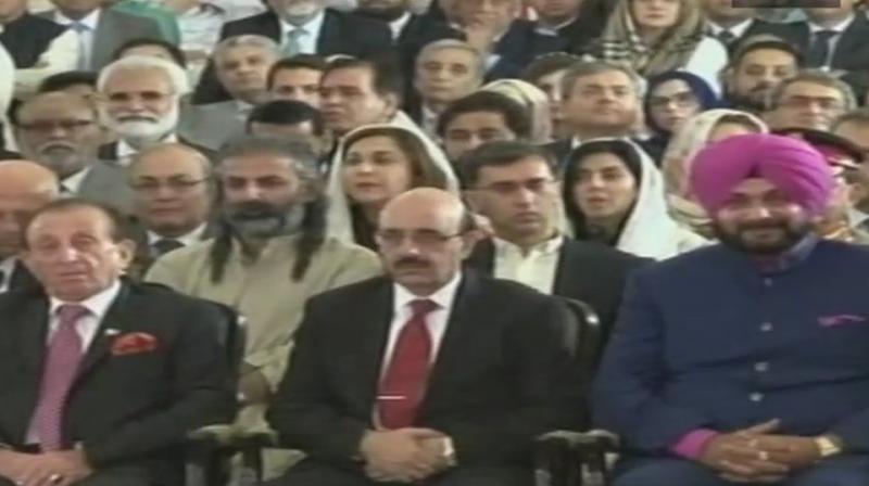 Navjot Singh Sidhu was seated next to the President of PoK Masood Khan at Imran Khans oath-taking ceremony as Pakistan Prime Minister. (Photo: Twitter / ANI)