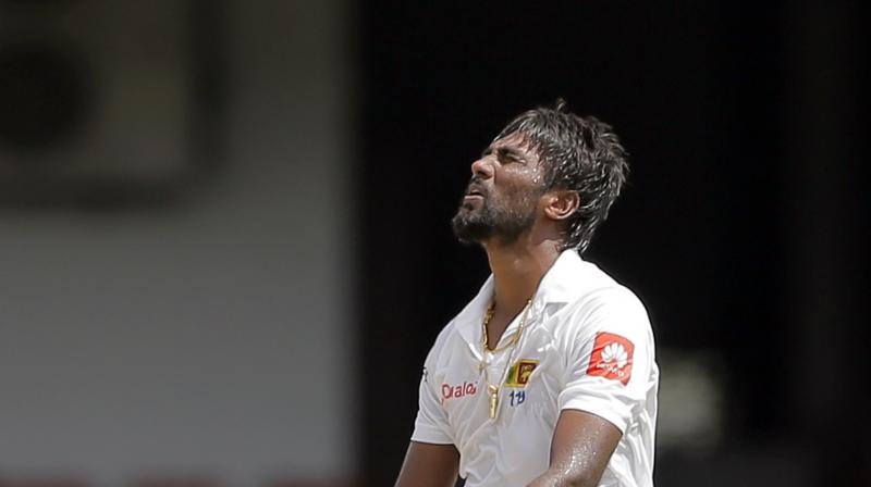 With Pradeep ruled out, Karunaratne, who took 1-31 in the first innings, will have to bowl his gentle medium pace if there is a second India innings.(Photo: AP)