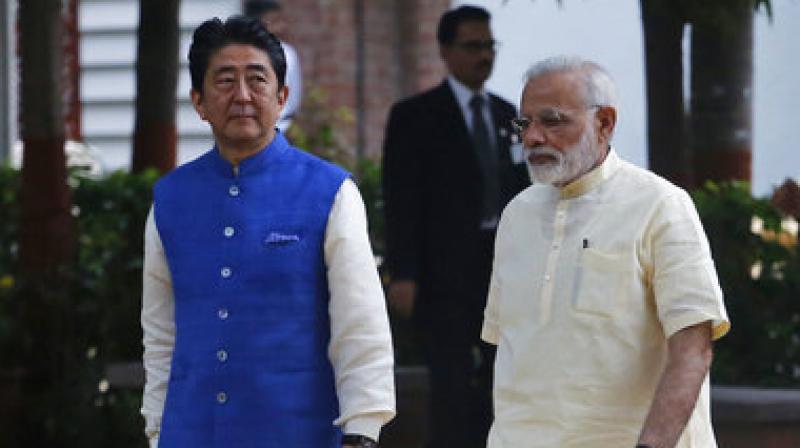 Shinzo Abe, Narendra Modi  Japanese Prime Minister Shinzo Abe, left, and Indian Prime Minister Narendra Modi walk inside Sabarmati Ashram, or Gandhi Ashram, in Ahmadabad, India.