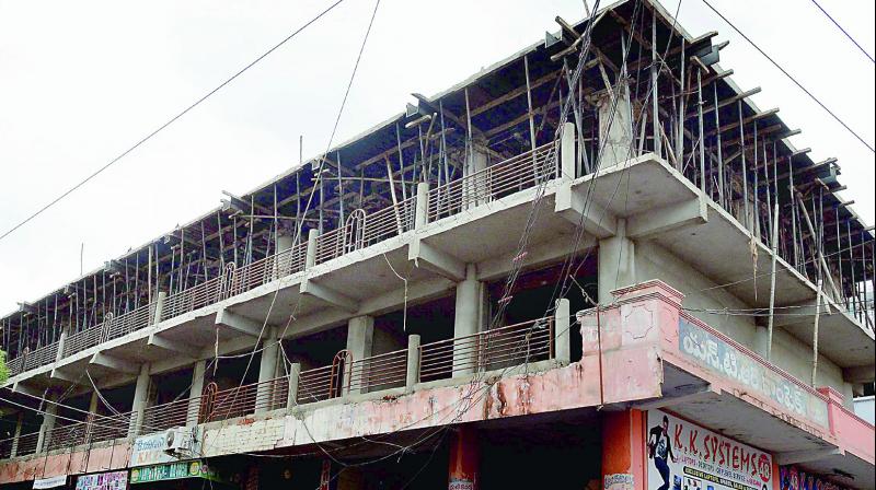 Two additional floors being constructed on NTR shopping complex at Governorpet in Vijayawada on Sunday.   (Photo: DC)