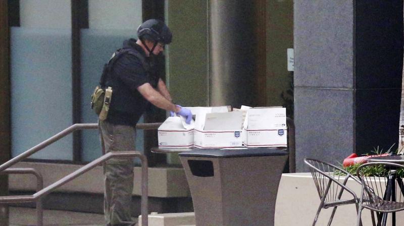 The San Diego Fire Rescue department bomb squad looks over a suspicious package on Wednesday. (Photo: AP)
