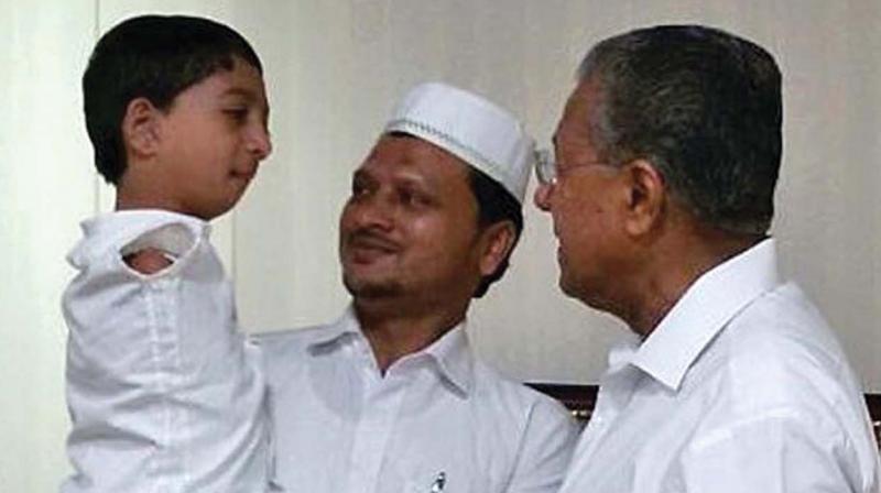 Mohammed Asim and his father Mohammed Shaheed with CM Pinarayi Vijayan. 	 	(File picture)