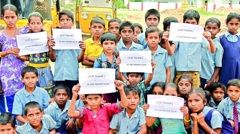 Students display placards thanking DC and Premier Solar Systems Pvt. Ltd.  (Photo: DC)