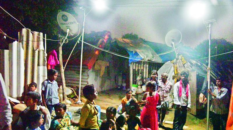 Solar lamps installed by Premier Solar Systems light up the Ambedkar huts area on Wednesday. (Photo: DC)