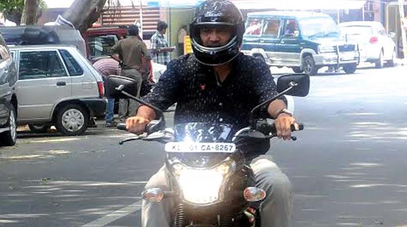 A two-wheeler owner with AHO rides on Press Club Road, Thiruvananthapuram . (Photo: DC)