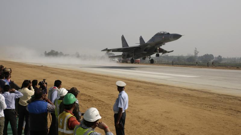 An Indian Air Force (IAF) fighter jet practice lands on the Agra-Lucknow highway in Unnao. (Photo: PTI)