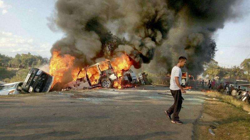 Angry people set on fire vehicles in Imphal East district in protest against the United Naga Council (UNC)s indefinite economic blockade. (Photo: PTI)
