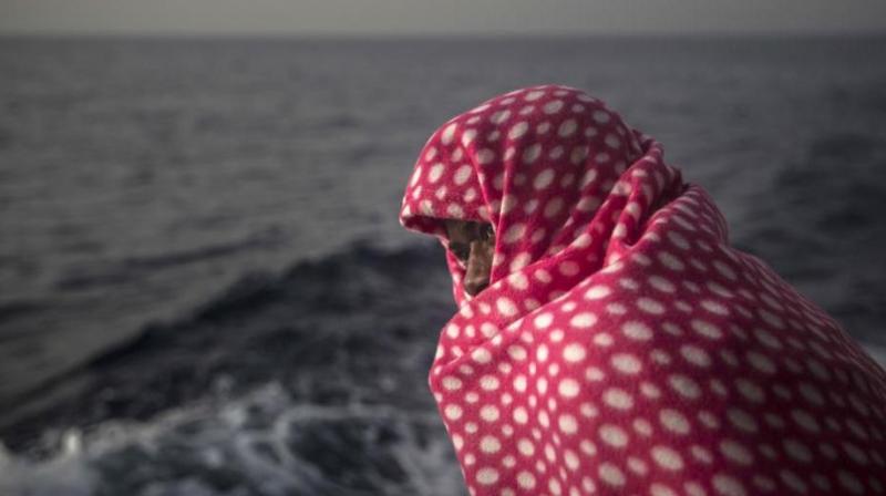 A migrant rests aboard Golfo Azurro, the Spanish NGO Proactiva Open Arms rescue ship, off the Libyan coast. (Photo: AP)