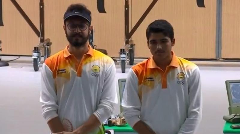Debutant teenager Saurabh Chaudhary clinched Indias first shooting gold of the 18th Asian Games while Abhishek Verma won bronze medal in the mens 10m air pistol event. (Photo: Twitter / IOA India)