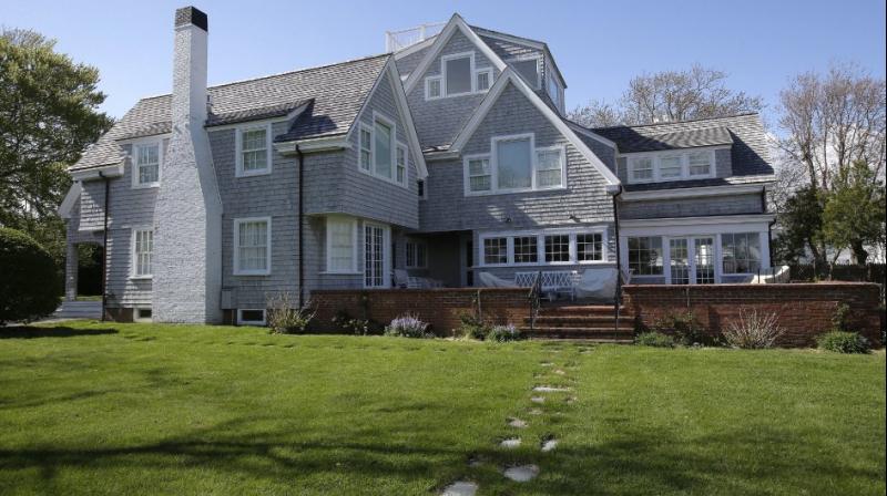 A house that was once the residence of President John F. Kennedy is surrounded by trees in Hyannis Port, Mass. Pieces of the home can now be called pieces of art. (Photo: AP)