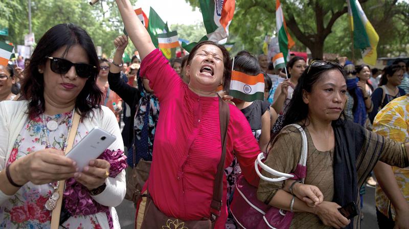 Pro-Gorkhaland activists protest in front of parliament in New Delhi on Sunday (Photo: AP)