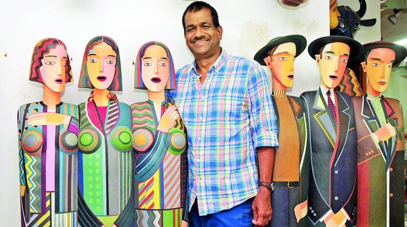 Artist Jagadish Chinthala with some of his works