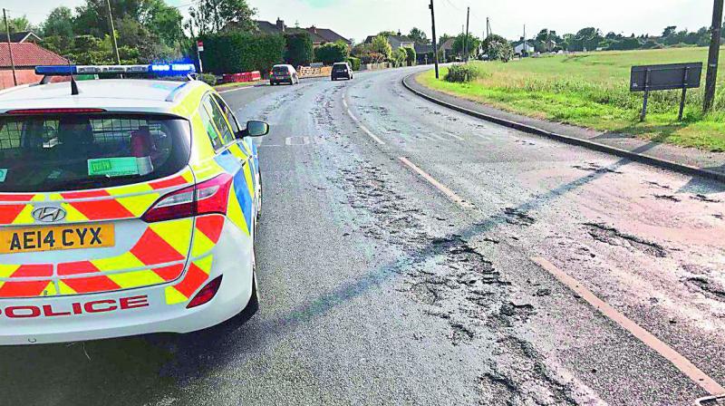 An image shared by the Cambridgeshire police show emergency repair work being carried on the melted roads. (Photo: via Web)