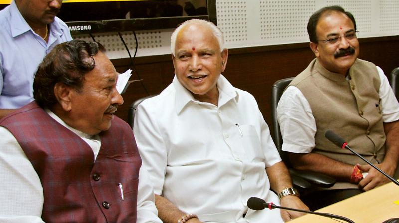 State BJP president B.S. Yeddyurappa with party leaders  K.S. Eshwarappa and Arvind Limbavalli during the party office-bearers meeting in Bengaluru on Thursday (Photo: DC)
