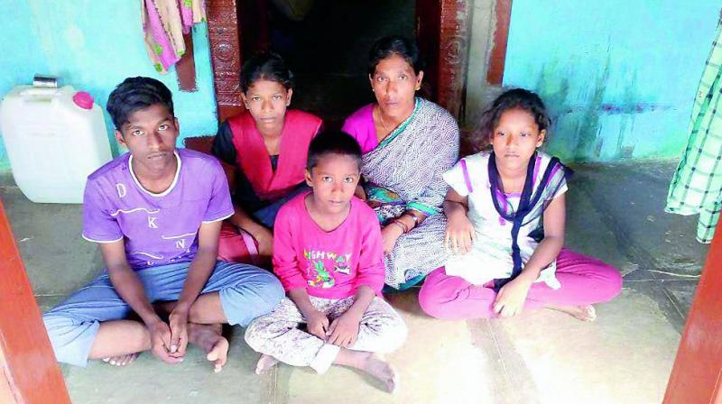 Pochaiahs wife and kids at home in their village.