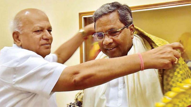 Newly appointed KPCC working president S.R. Patil who was  IT/BT minister earlier, with Chief Minister Siddaramaiah in a file photograph