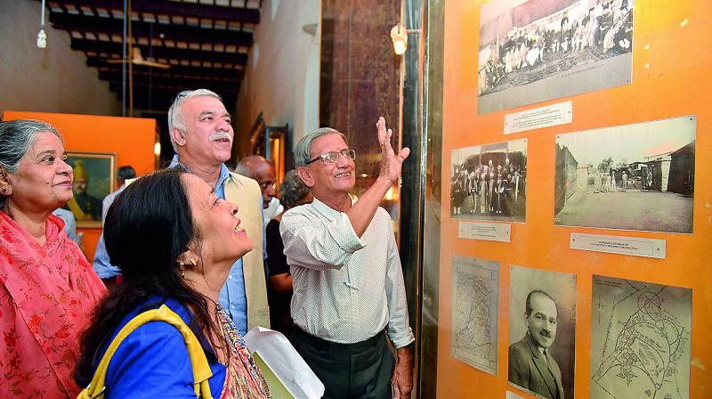 People appreciate the pictures of Osmania Universitys early days being exhibited at the Nizam Museum.