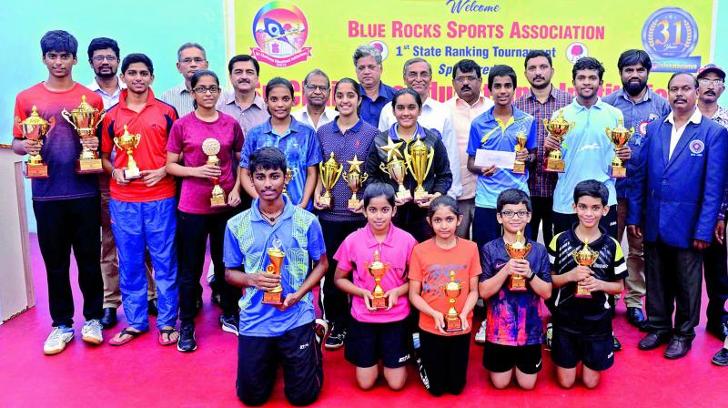 Winners and runners-up pose with their trophies at the Telangana State Ranking table tennis tournament played in Hyderabad.