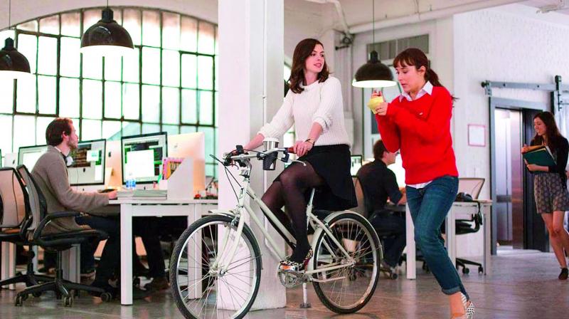 In the movie The Intern, Anne Hathaways character juggles office and home. She is usually so busy that she cycles on the work-floor, to go from one meeting to the other