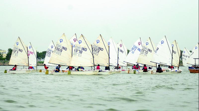 Sailors in action during the Secunderabad Sailing Club-Greenco Youth open regatta at Hussainsagar lake in Hyderabad on Sunday.